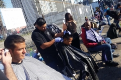 Homeless haircuts on the streets of downtown San Diego.